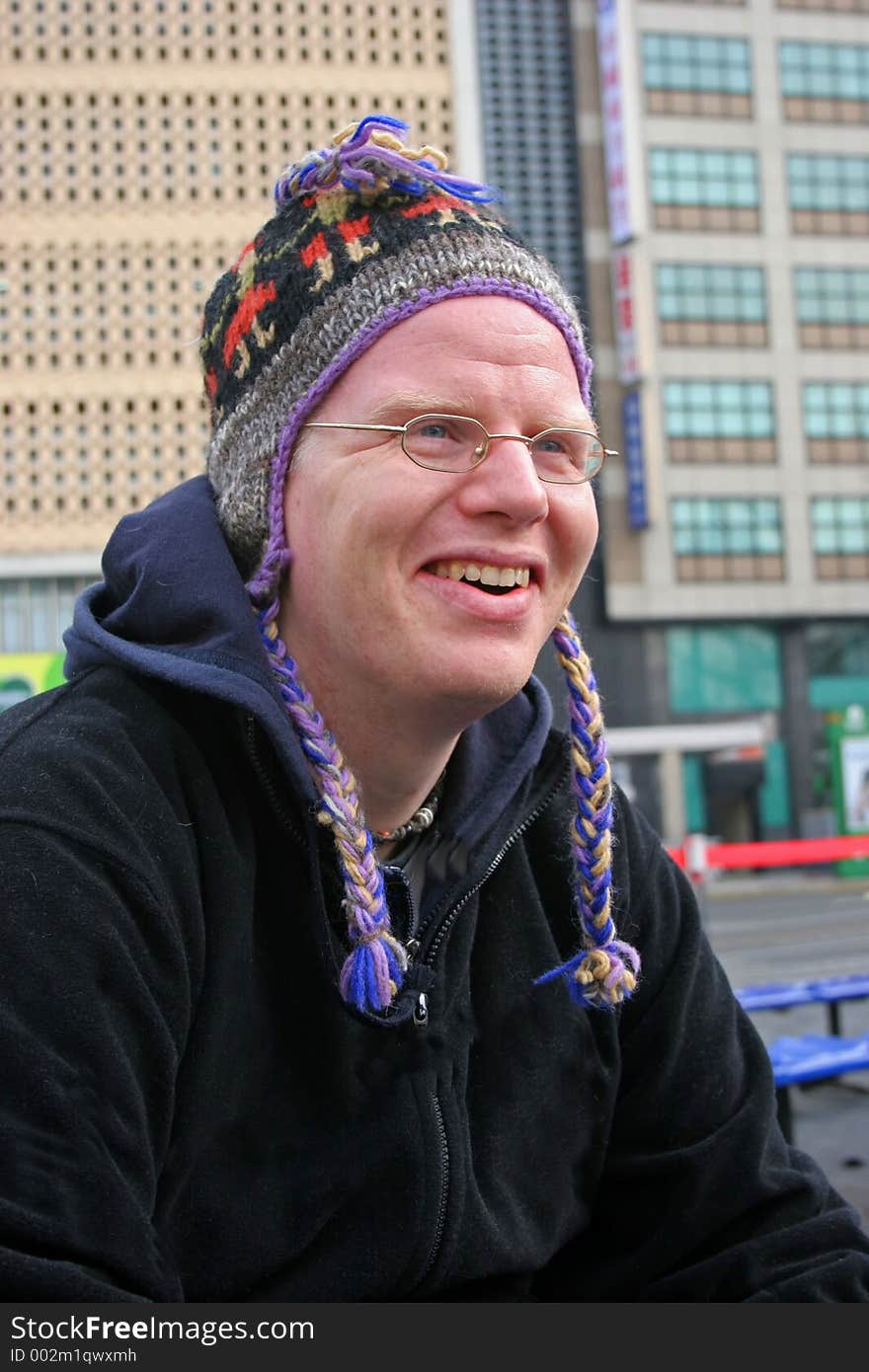 Cheerful man in cute winter hat