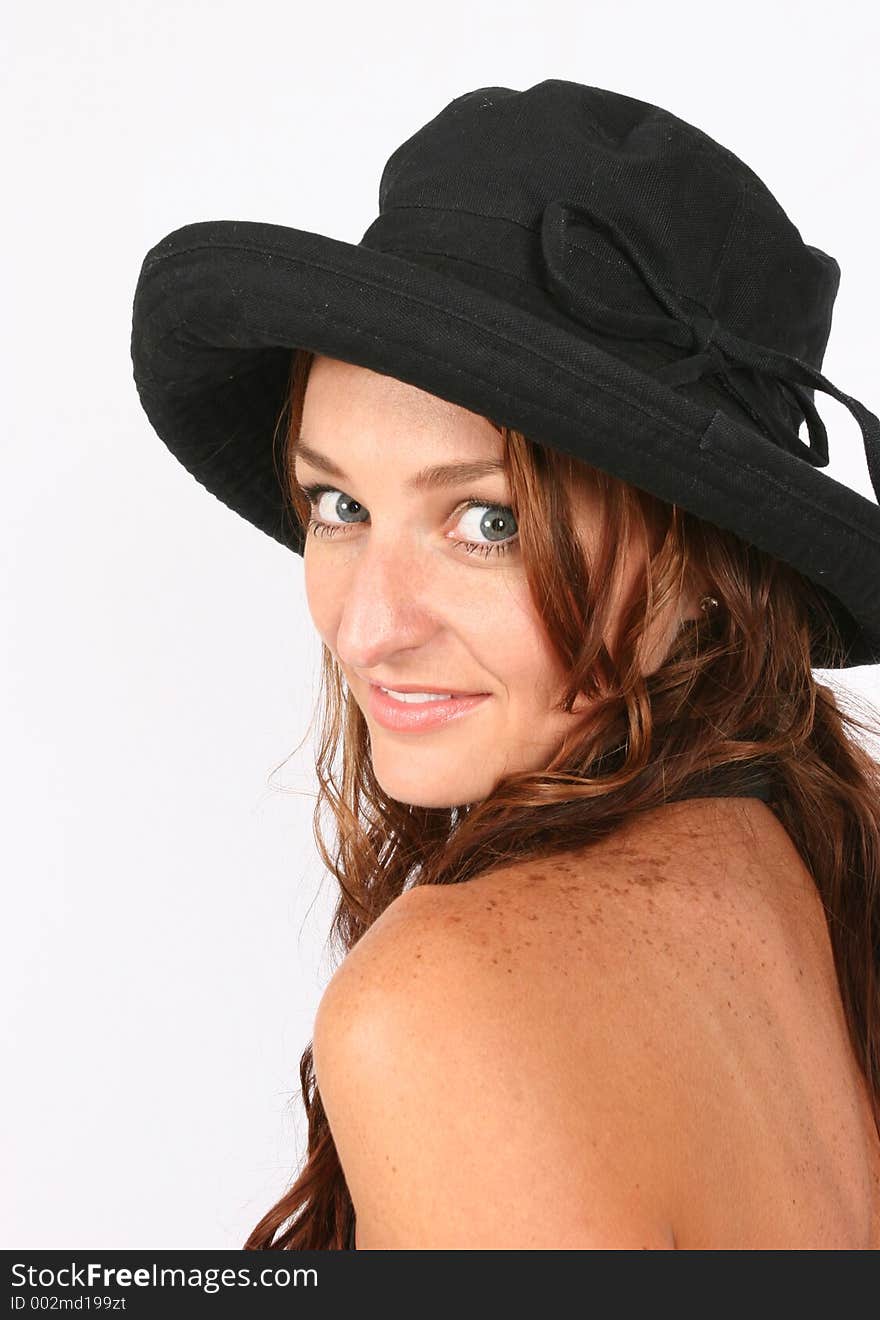 Model posing with her hat on. Model posing with her hat on