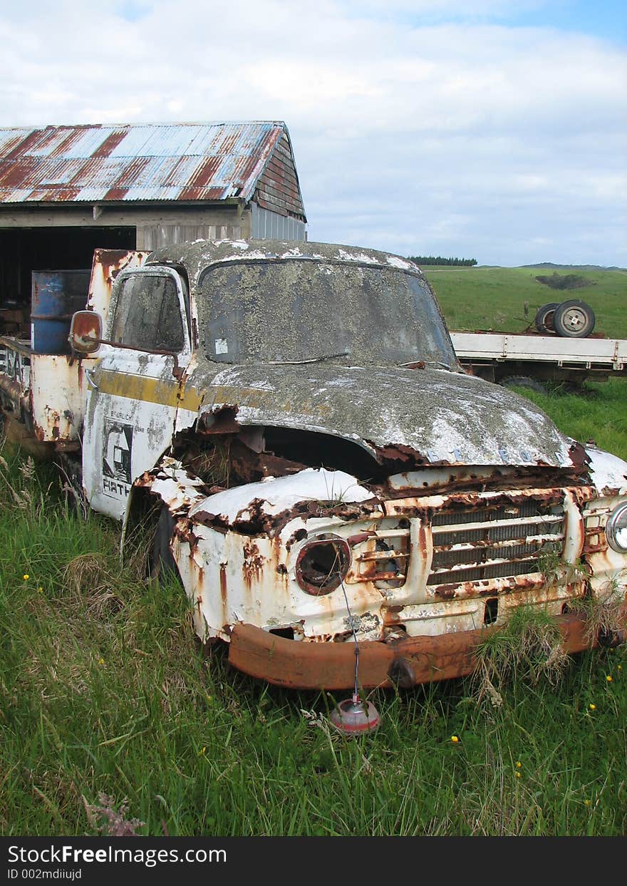 rusted carwreck on farmland in Northland ,New Zealand. rusted carwreck on farmland in Northland ,New Zealand