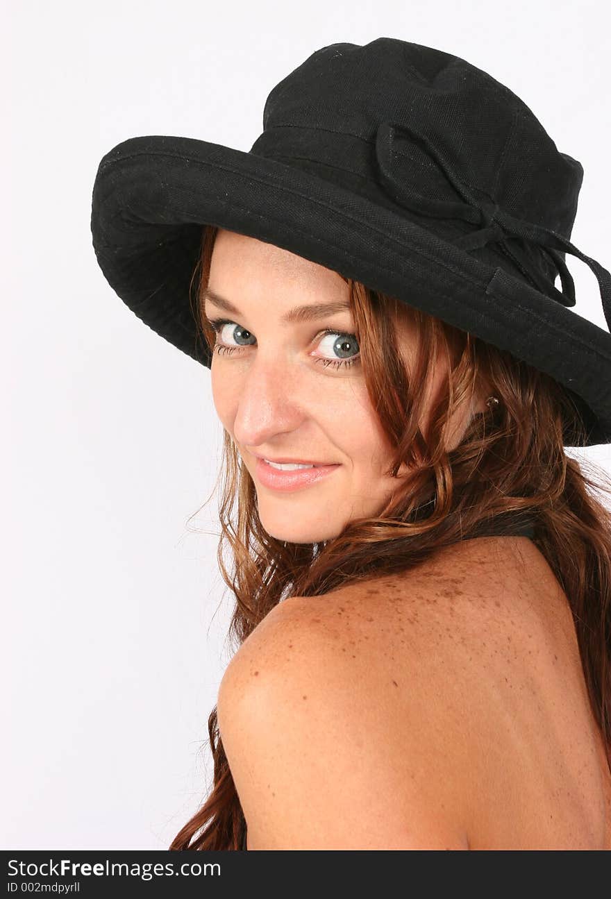 Model posing with her hat on. Model posing with her hat on