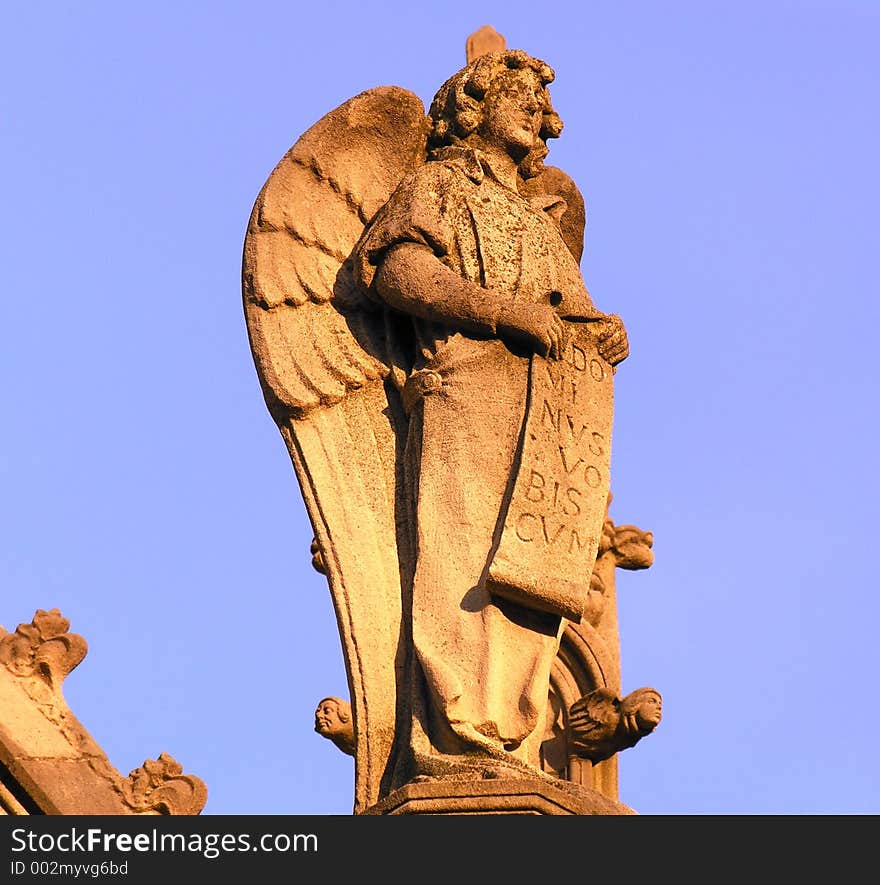 Carved figure out of stone, on historic church.