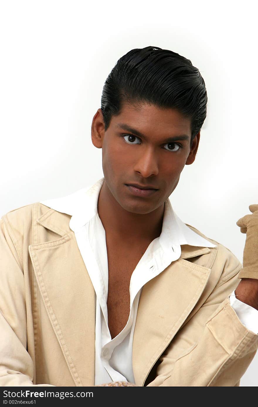 Handsome young exotic man, in cream suit. Handsome young exotic man, in cream suit