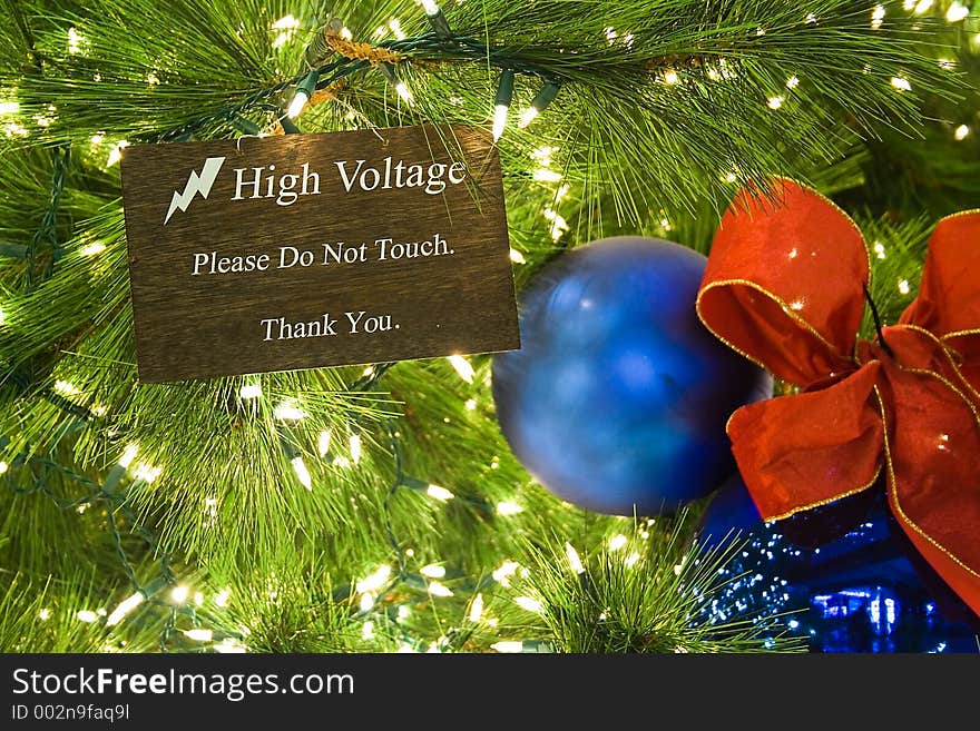 Christmas lightings with a high voltage signboard.