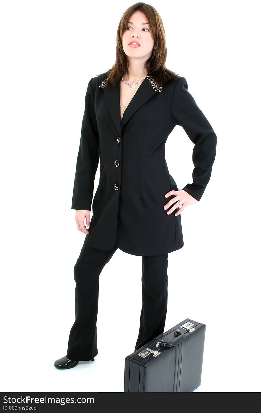 Beautiful young woman in suit with briefcase. Standing over white background. Beautiful young woman in suit with briefcase. Standing over white background.