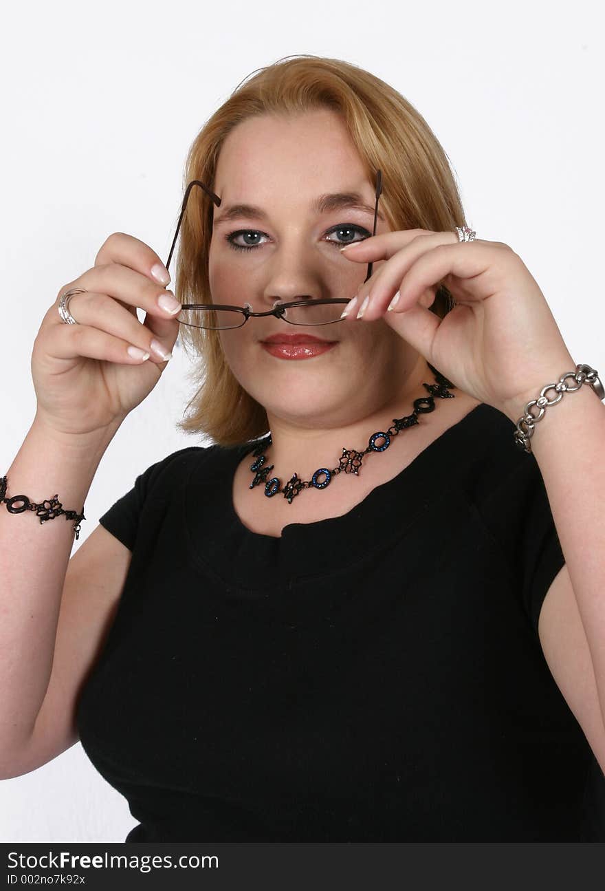 Businesswoman holding her spectacles