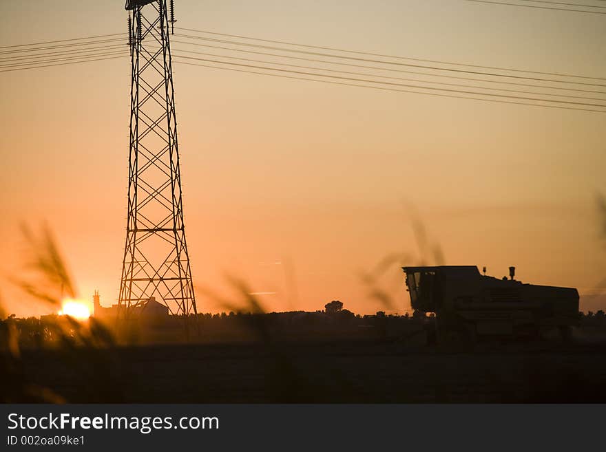 Next to a high-voltage tower. Next to a high-voltage tower