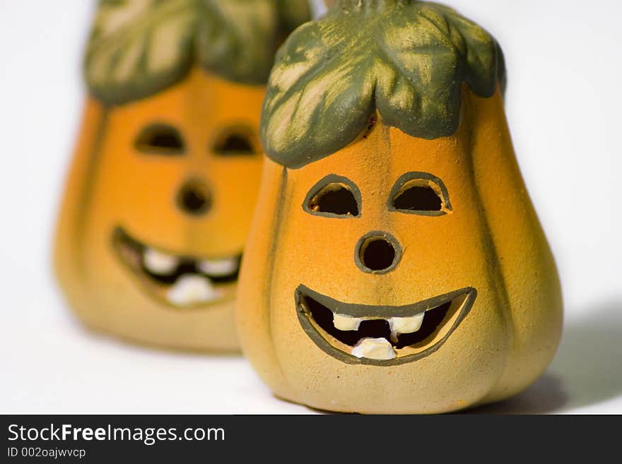 Smiley Ceramic Jack-O-Lantern Pumpkins against a white background