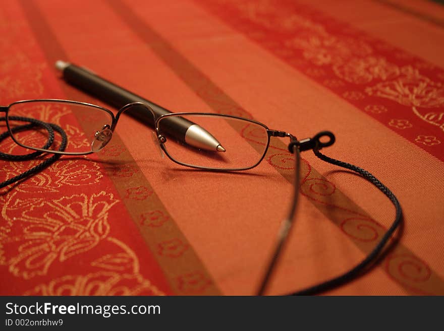 Reading glasses on a table. Reading glasses on a table