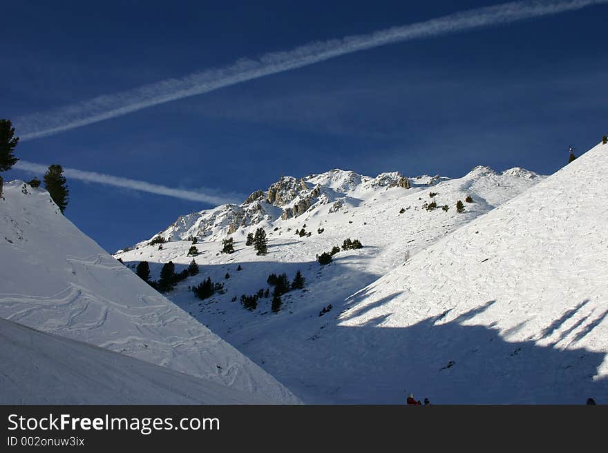 Snowy Mountains And Vapour Trails