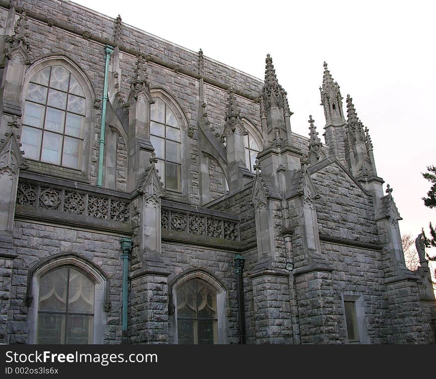 Side view of church and gray sky.