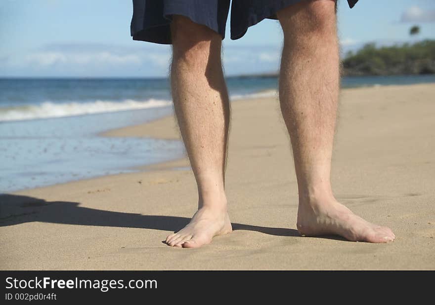 Man's feet on the beach. Man's feet on the beach