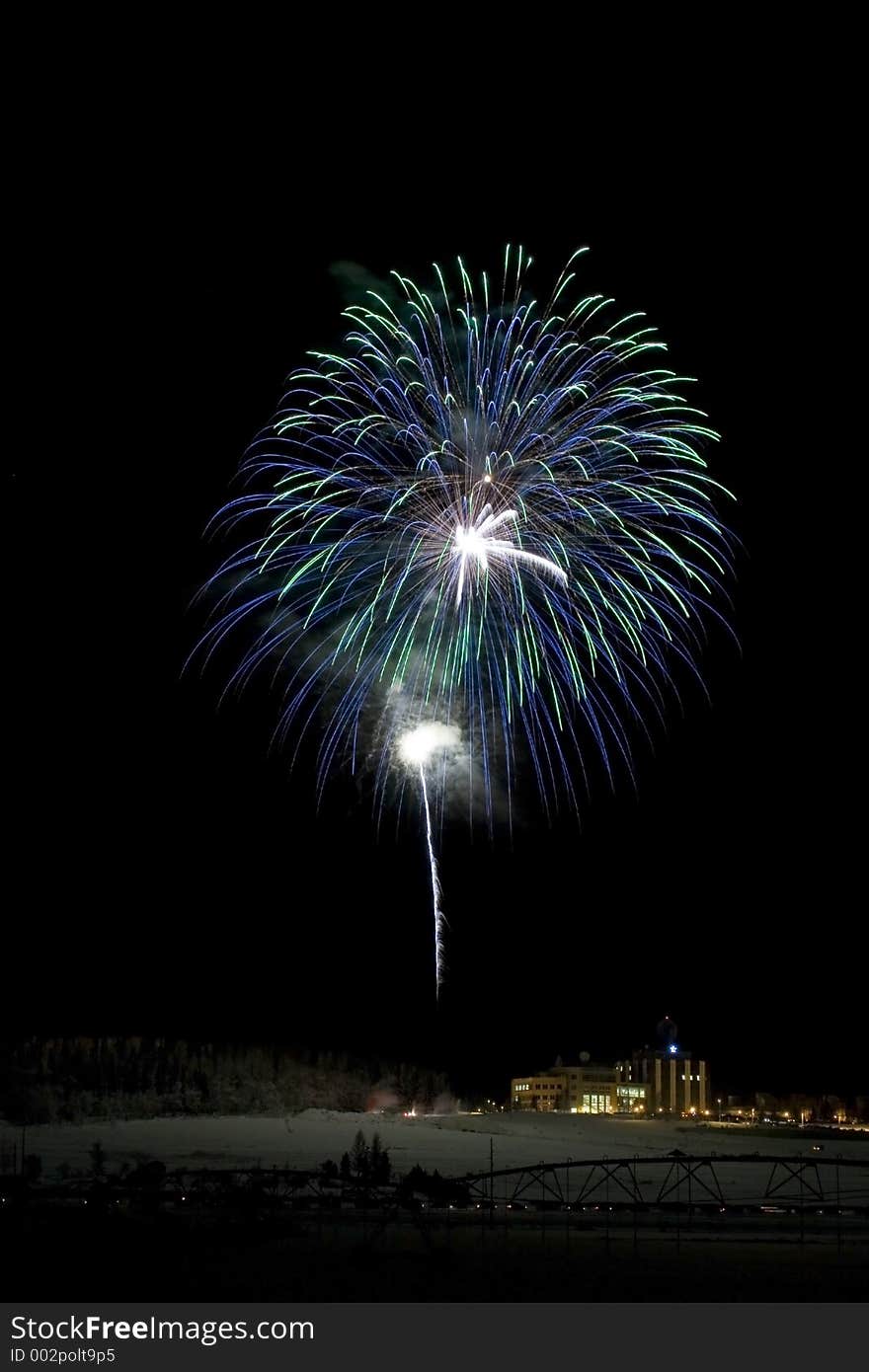 Two large fireballs in green and blue intersecting in the sky. Two large fireballs in green and blue intersecting in the sky