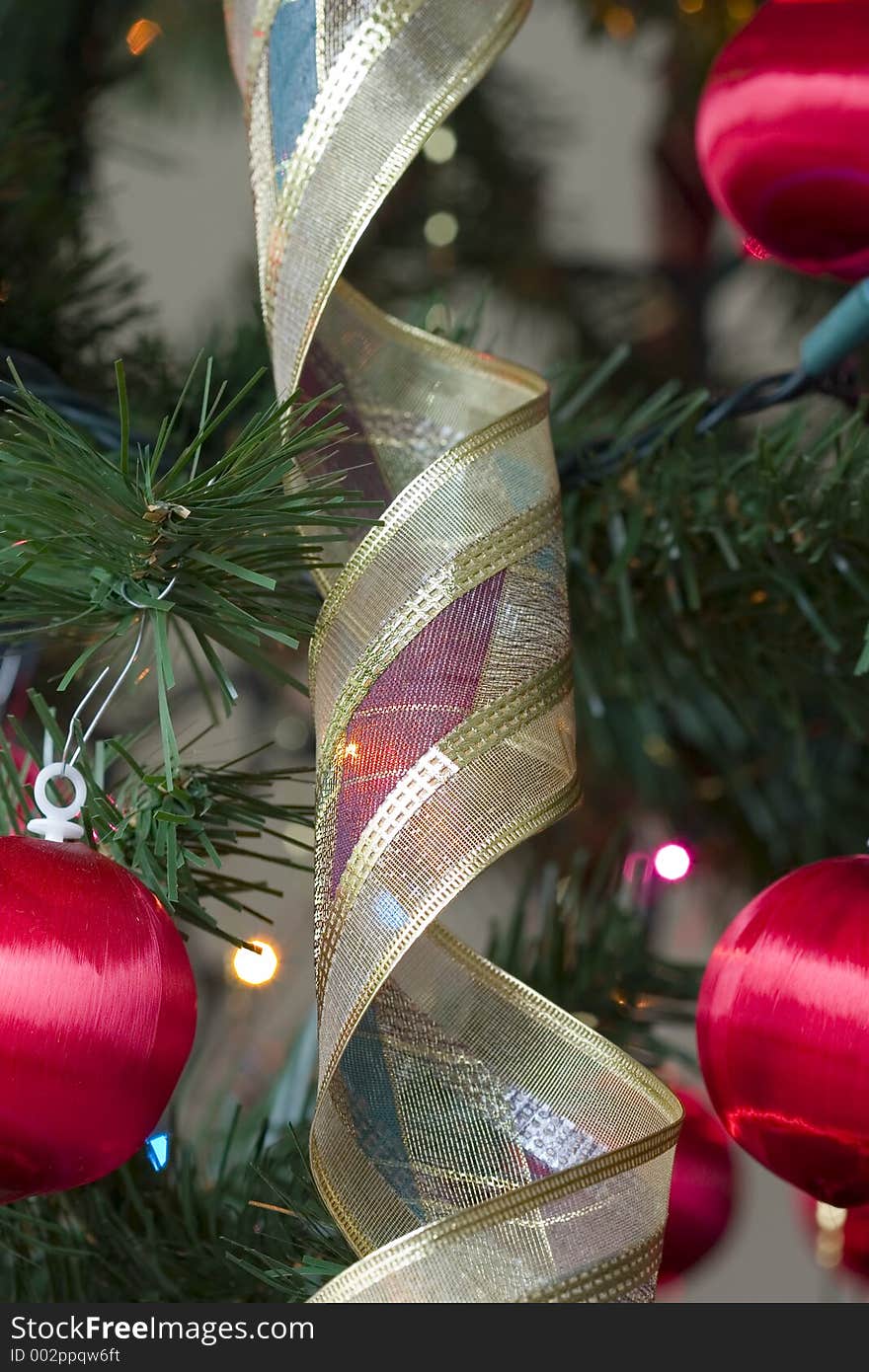 Globes, lights and bunting in a Christmas tree. Globes, lights and bunting in a Christmas tree