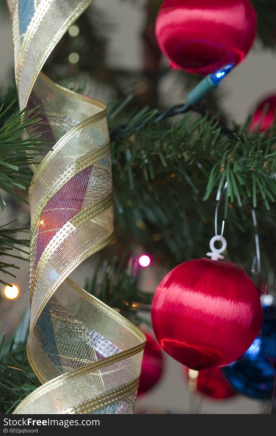 Globes, lights and bunting in a Christmas tree. Globes, lights and bunting in a Christmas tree