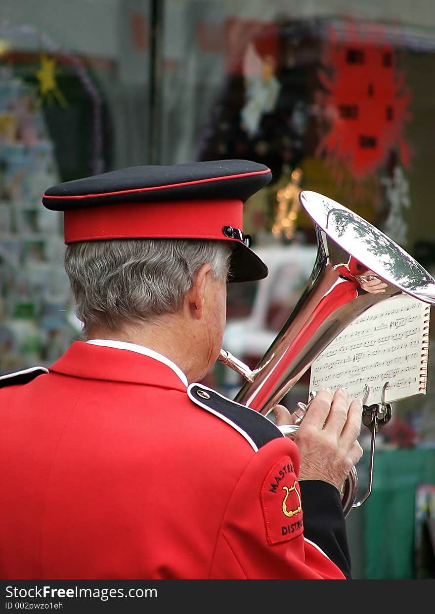 Bandsman playing instrument. Bandsman playing instrument