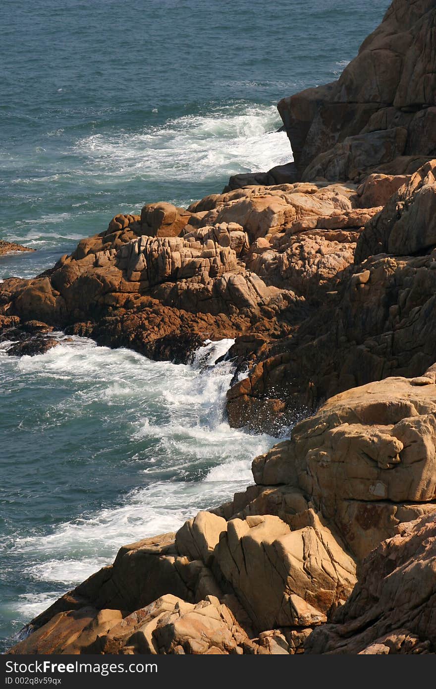 Waves moving in against a rocky shore. Waves moving in against a rocky shore.