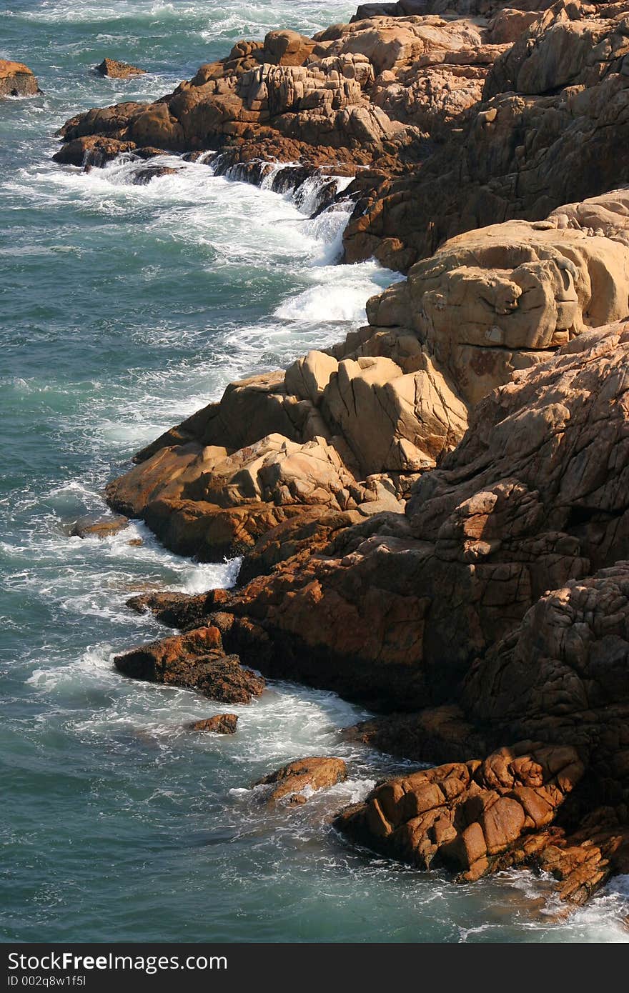 Waves moving in against the rocky shore at Shek O, Hong Kong. Waves moving in against the rocky shore at Shek O, Hong Kong.