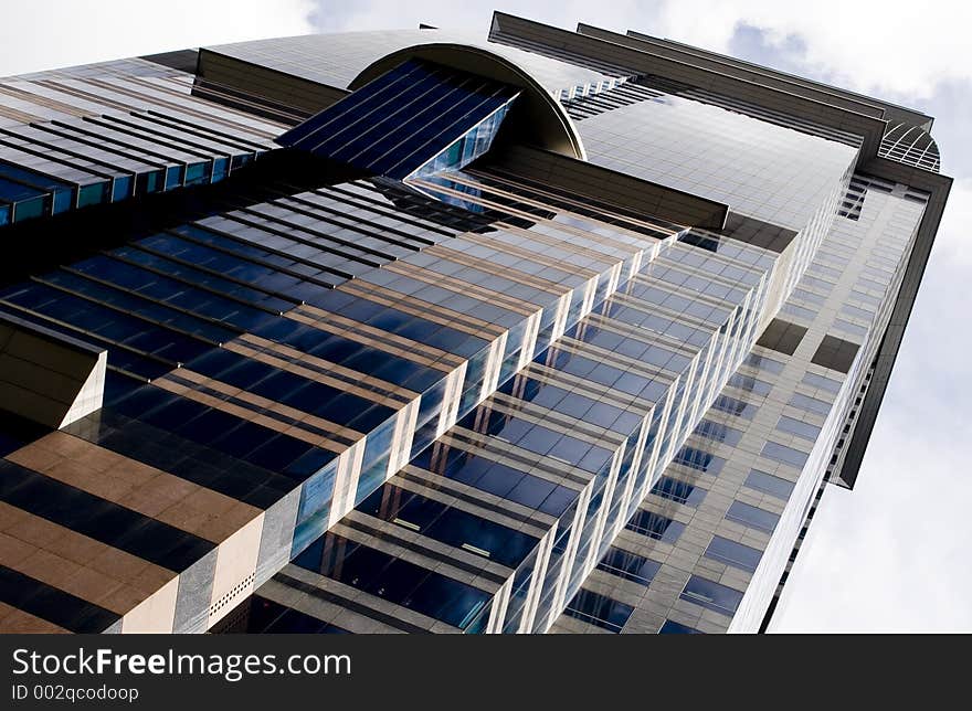 A skyscraper stands tall in Singapore's Central Business District. A skyscraper stands tall in Singapore's Central Business District