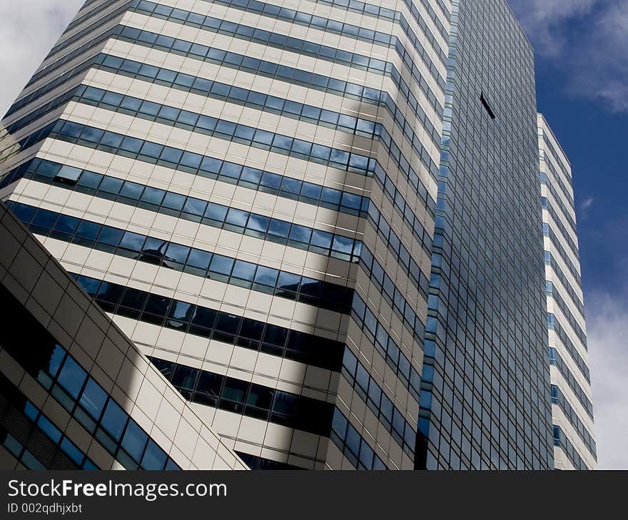 A single window is open in a huge glass skyscraper. A single window is open in a huge glass skyscraper