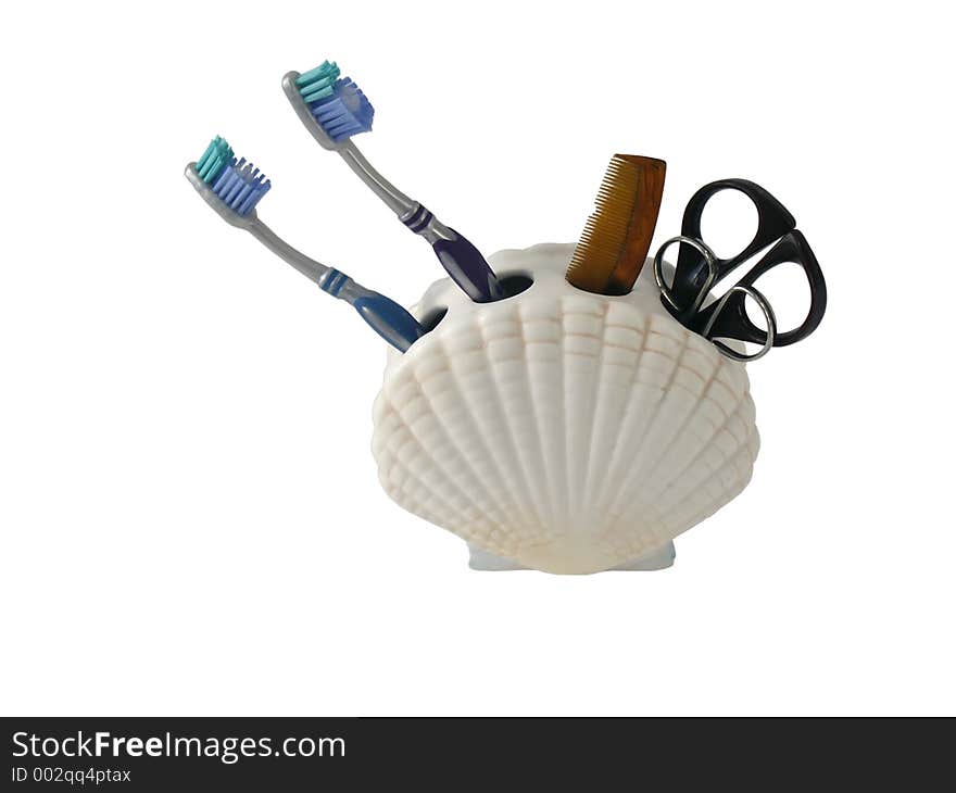 Set of toiletries in seashell holder, isolated with clipping path. Set of toiletries in seashell holder, isolated with clipping path