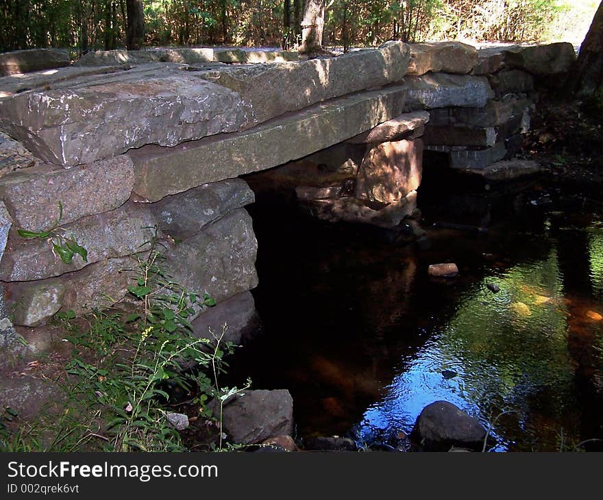 Historic Granite Bridge on river.