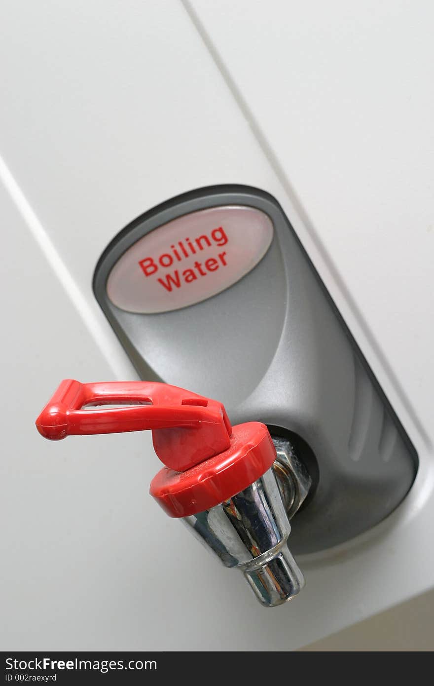 Boiling water tap in a commercial kitchen. Focus on the tap/spigot.  Slightly OOF on the words. Boiling water tap in a commercial kitchen. Focus on the tap/spigot.  Slightly OOF on the words