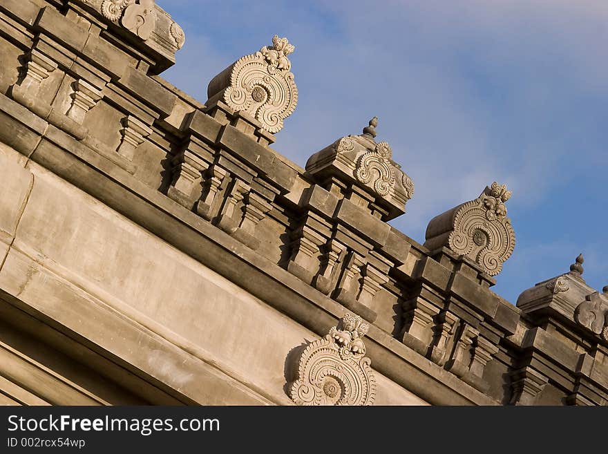 An ornate sculpture on the roof of an Indian temple. An ornate sculpture on the roof of an Indian temple