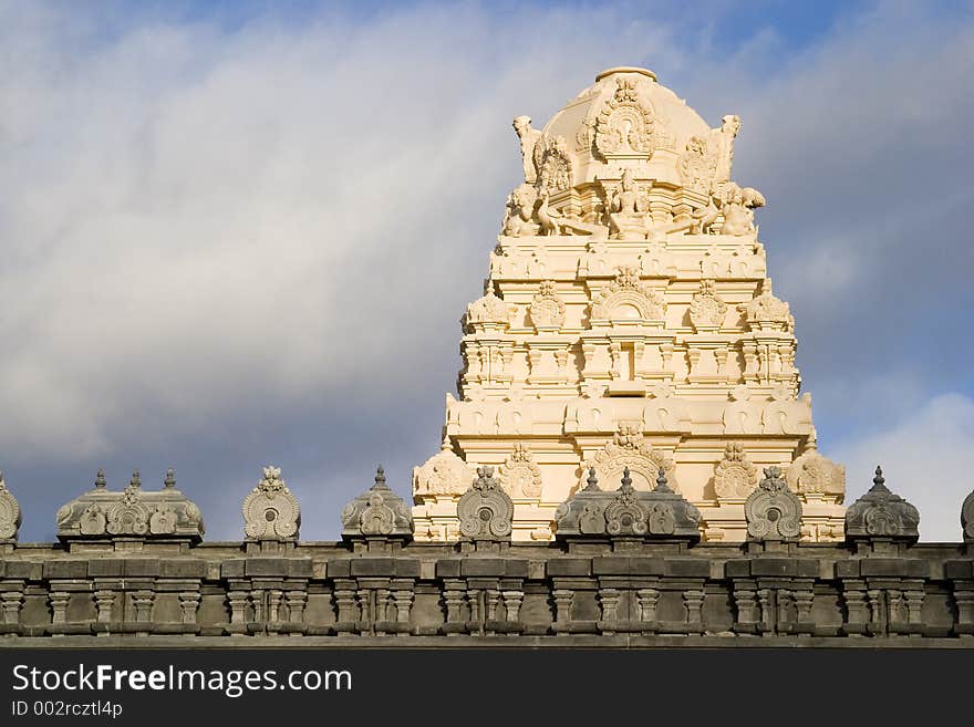 An ornate sculpture on the roof of an Indian temple. An ornate sculpture on the roof of an Indian temple