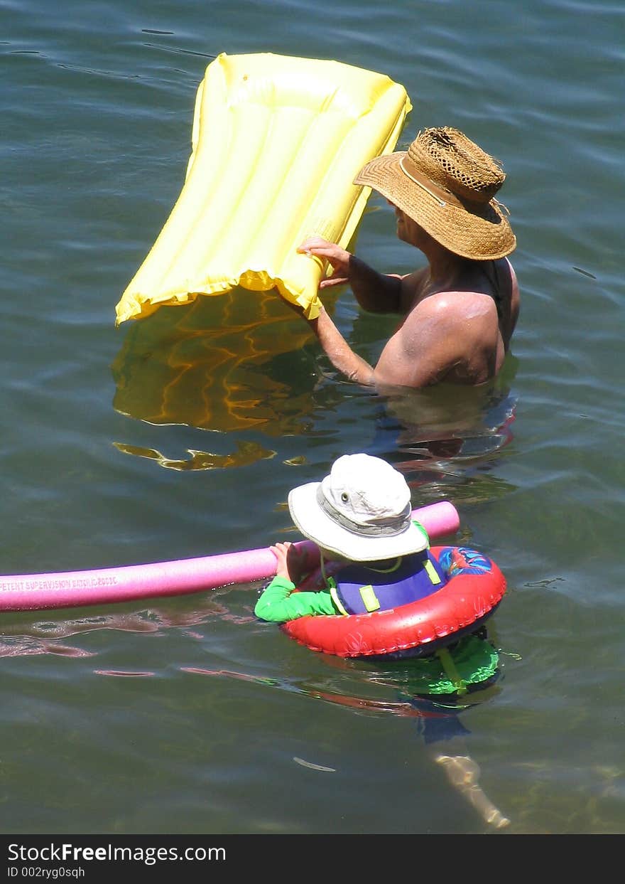 Father and daughter swimming together