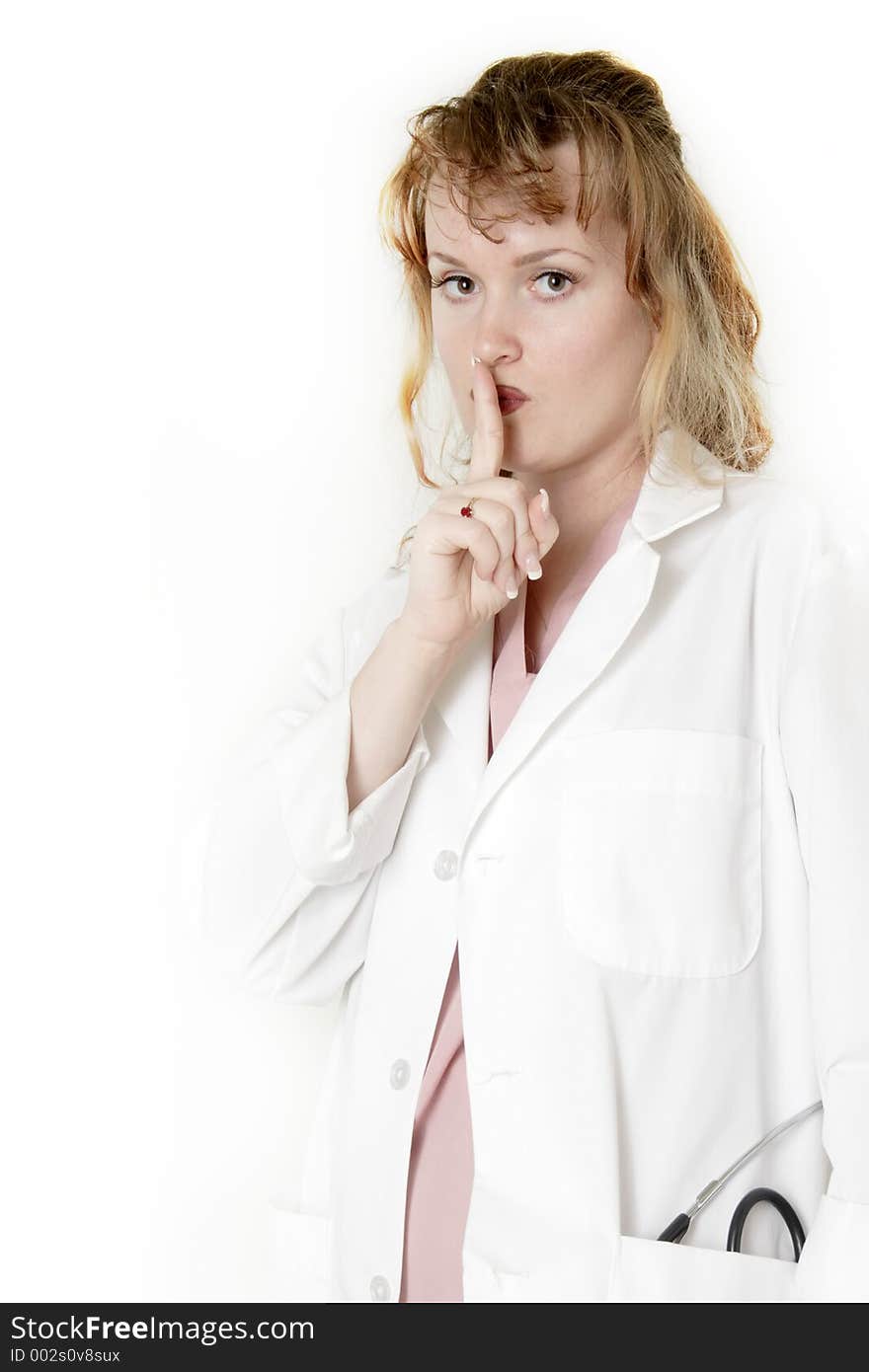 Lady doctor with finger in front of lips