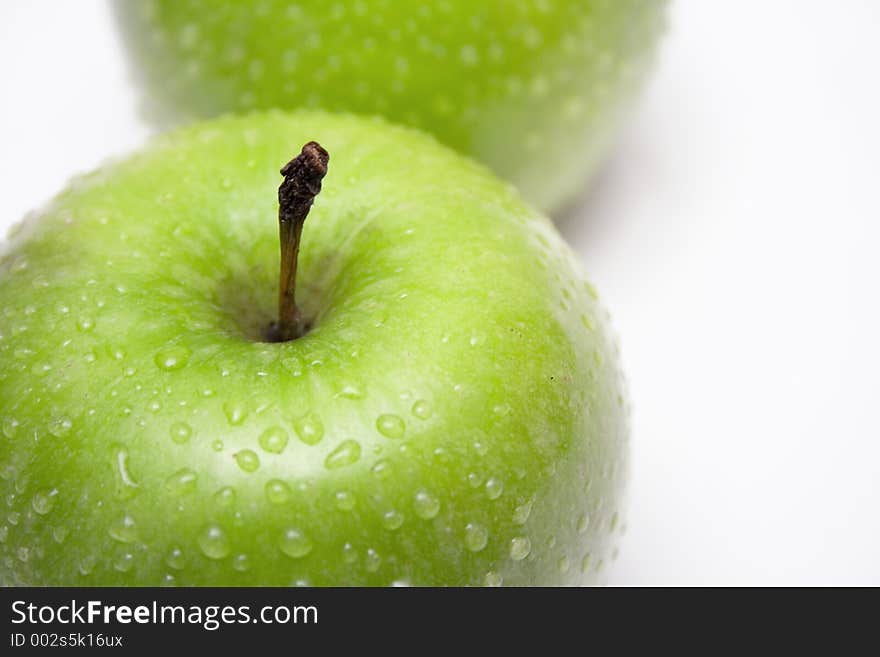 Raindrops on two delicious green apples. Raindrops on two delicious green apples.