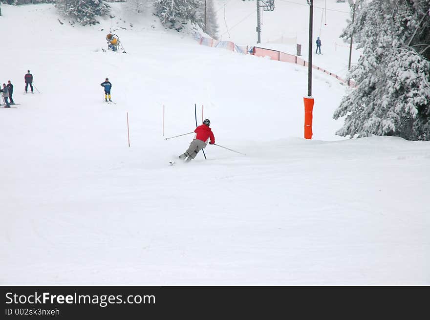 Skier slaloming, natural motion blur on the background. Skier slaloming, natural motion blur on the background