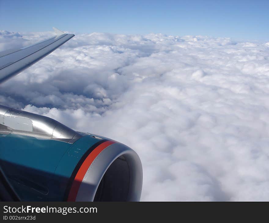 Airplane Engine above Clouds