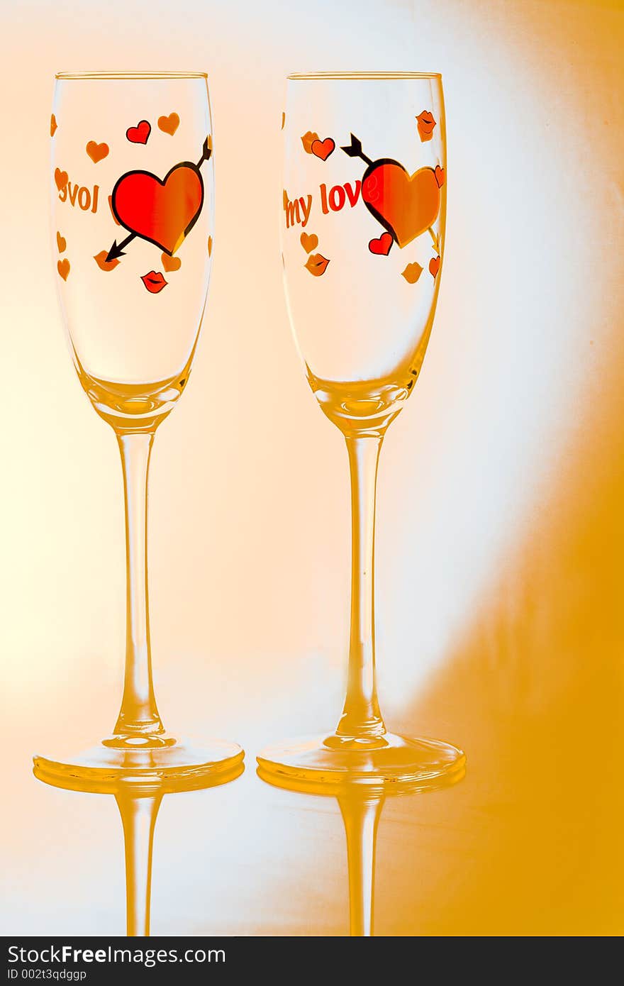 Couple of glasses with orange background. Couple of glasses with orange background