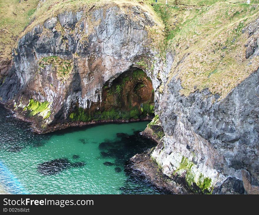 Green sea at the mouth of a cave. Green sea at the mouth of a cave