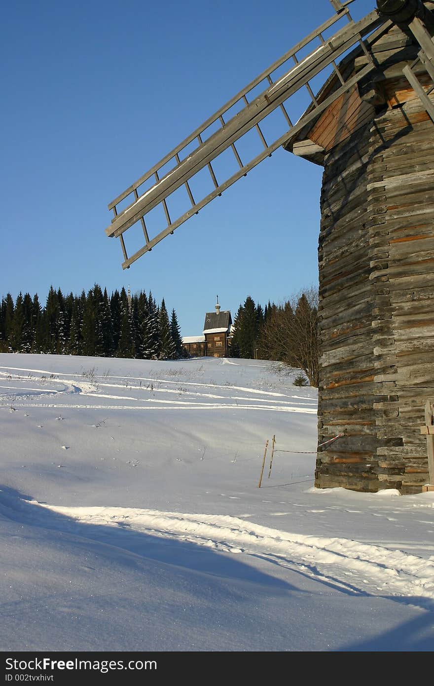 A windmill and a cathedral in Russian countryside