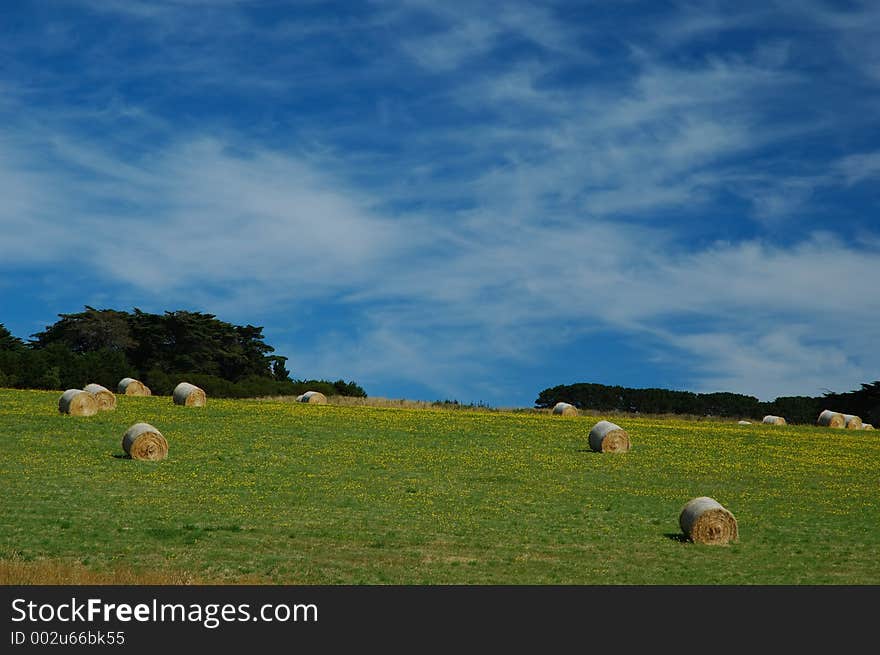 Round haystacks and blue sky