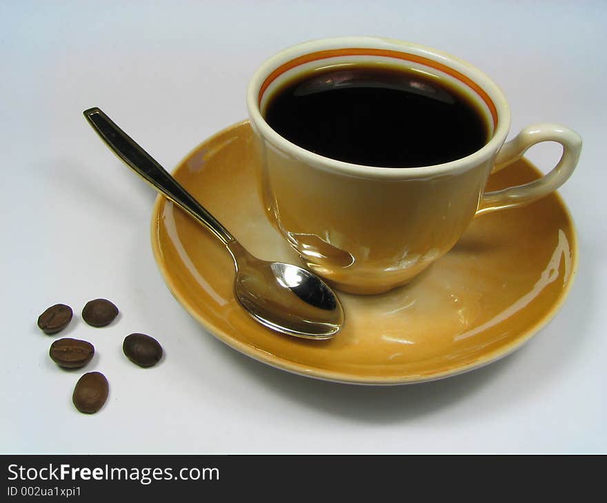 Cup of coffee and coffee beans. Cup of coffee and coffee beans