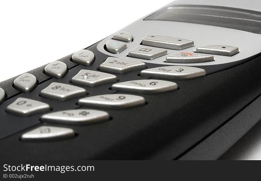 Detail of a cordless telephone on a white background. Detail of a cordless telephone on a white background.