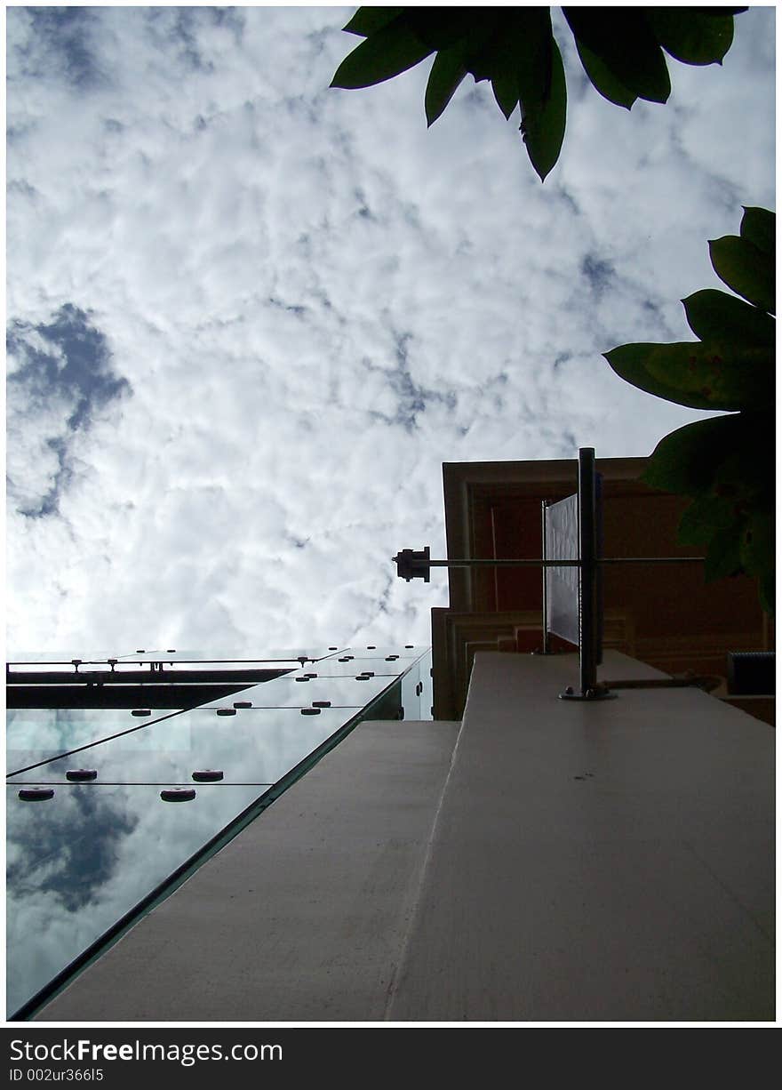 A beautiful framing with clouds, leaves and building. A beautiful framing with clouds, leaves and building.