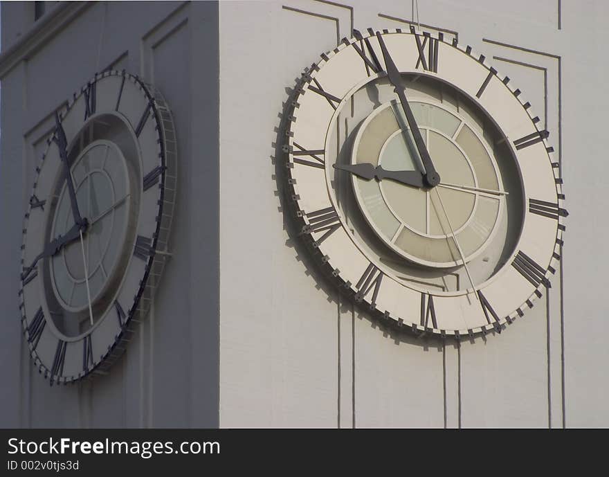 An old clocktower face tells time.