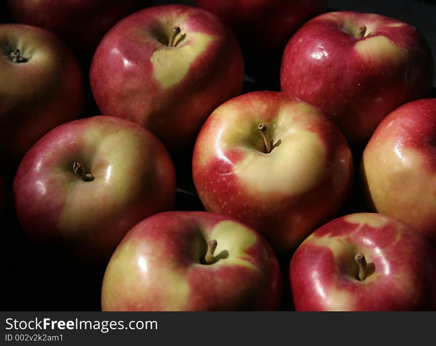 Group of red macintosh apples on dark background. Group of red macintosh apples on dark background