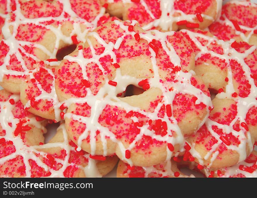 Butter cookies with pink sprinkles & frosting. Butter cookies with pink sprinkles & frosting.