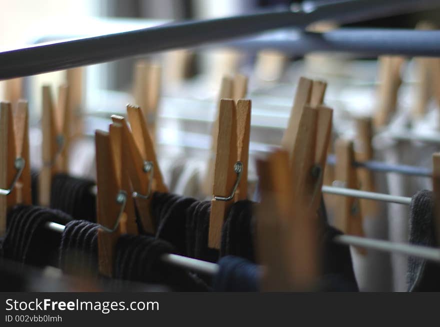 Laundry rack with clean laundry and wooden clothes pins