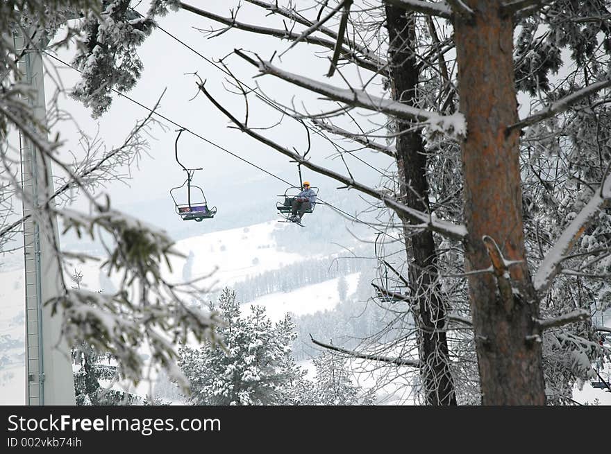 Snowboarder on chairlift