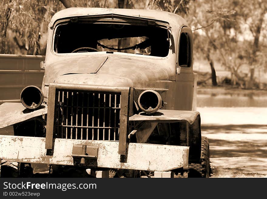 An old truck sits in decay after long out-living its glory days. An old truck sits in decay after long out-living its glory days.