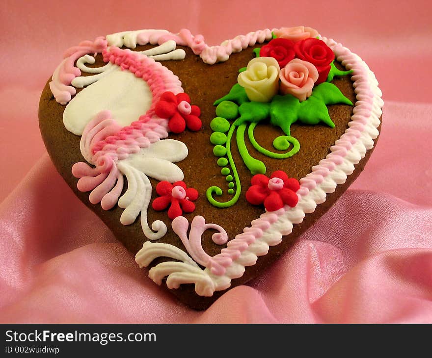 A valentine decorated gingerbread heart. A valentine decorated gingerbread heart