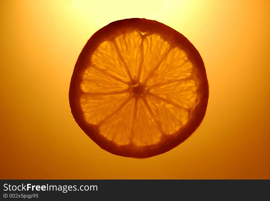 Orange slice suspended in the air