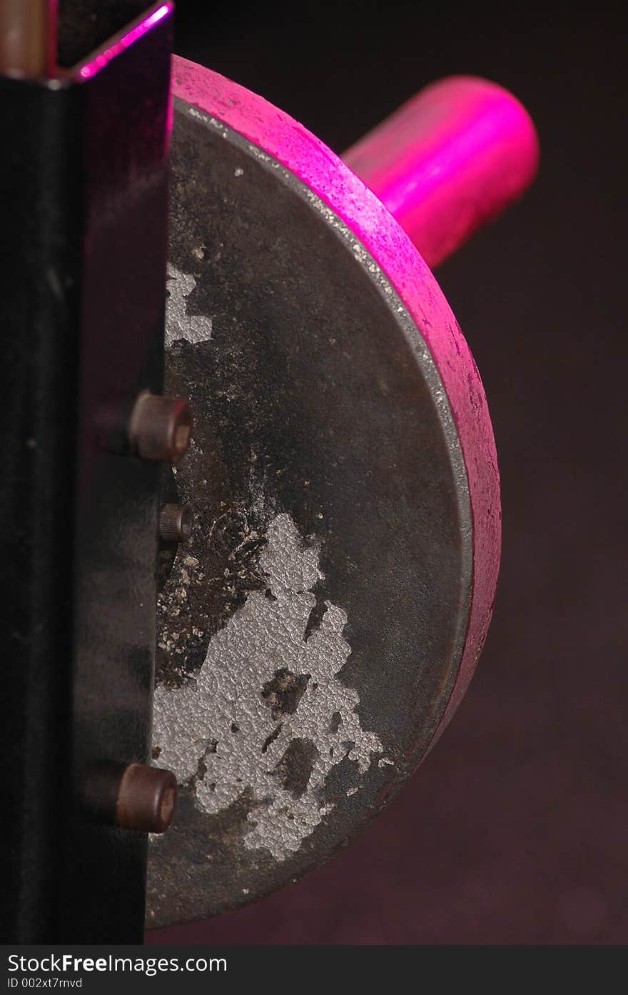 Worn barbell plate pink highlights