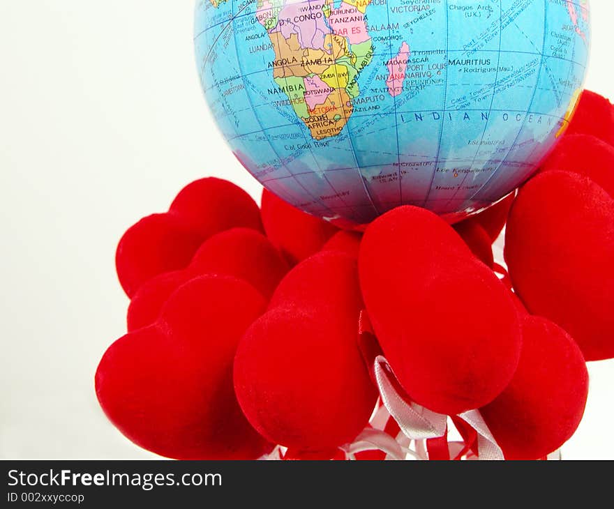 Earth globe on the red hearts. Earth globe on the red hearts